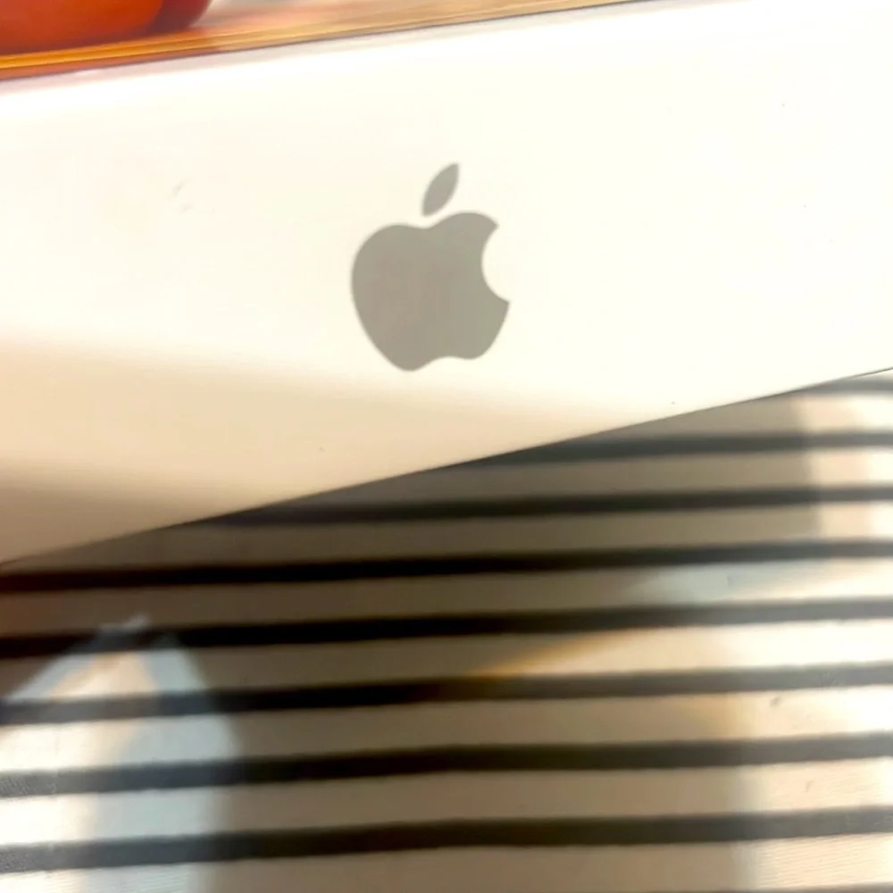 Apple iPhone 12 mini box and USB-C to Lightning Cable. No phone included.
